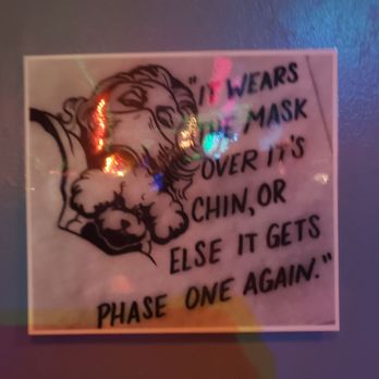 Cosmo Lounge - a sign on the wall of a bar - Dive Bars Near Me - Portland, Oregon