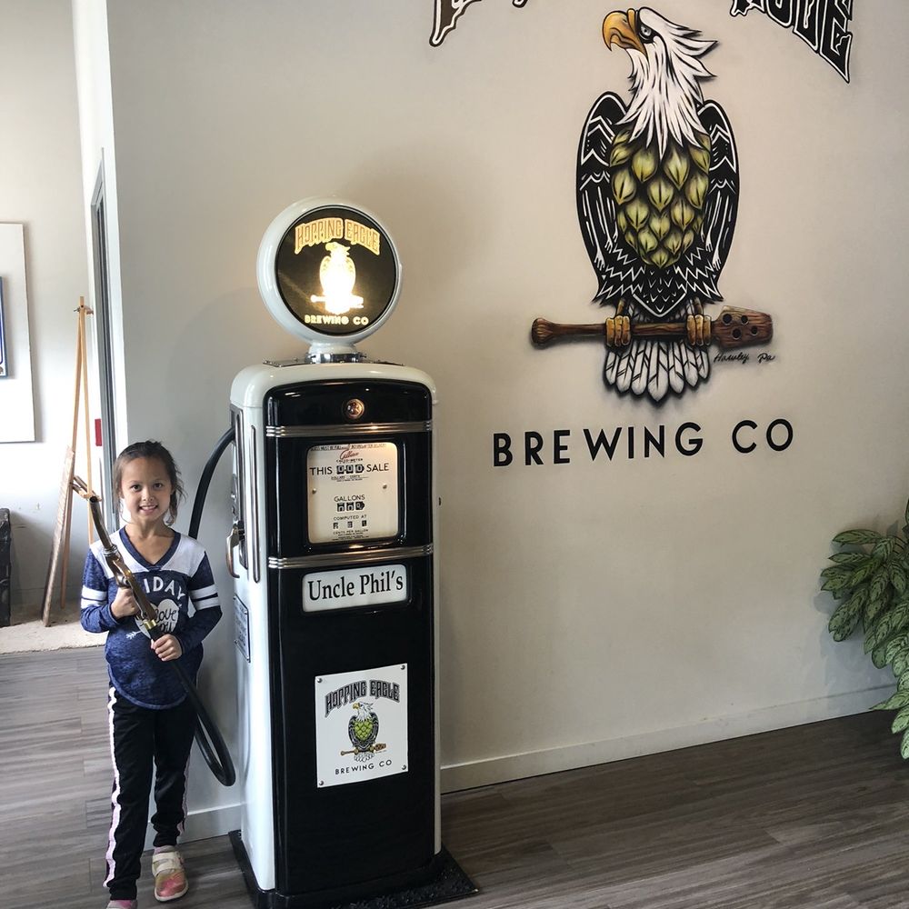 Hopping Eagle Brewing Company - a young boy standing next to a gas pump - Breweries Near Me - Hawley, Pennsylvania Hopping Eagle Brewing Company - a young boy standing next to a gas pump - Breweries Near Me - Hawley, Pennsylvania