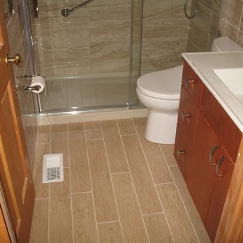 Century Tile & Carpet - a bathroom with a toilet and shower - Carpeting Near Me - Mount Prospect, Illinois Century Tile & Carpet - a bathroom with a toilet and shower - Carpeting Near Me - Mount Prospect, Illinois