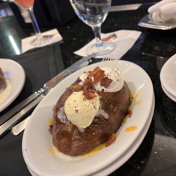 Ruth's Chris Steakhouse - Loaded Baked Potatoe with Butter, Sour Cream and Bacon. - Steakhouses Near Me - Ann Arbor, Michigan Ruth's Chris Steakhouse - Loaded Baked Potatoe with Butter, Sour Cream and Bacon. - Steakhouses Near Me - Ann Arbor, Michigan