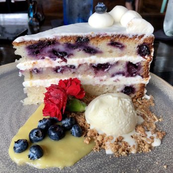 District Kitchen - Anderson Lane - Yet another pic of the blueberry lemon layer cake with cream cheese frosting, lemon curd, and white chocolate ice cream - New American Near Me - Austin, Texas