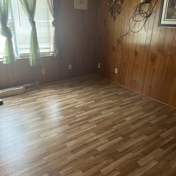 Romanoff Renovations - a wood paneled living room - Flooring Near Me - Poulsbo, Washington