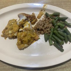Sealand Seafood & Steak - Grilled catfish with etouffee over it and cold bland green beans and cold dirty rice.