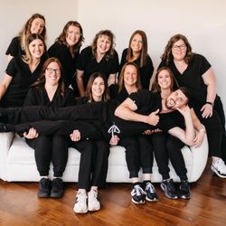 Embury Family Dentistry - Dr. Caitlin and Dr. Carl Embury with the Embury Family Team