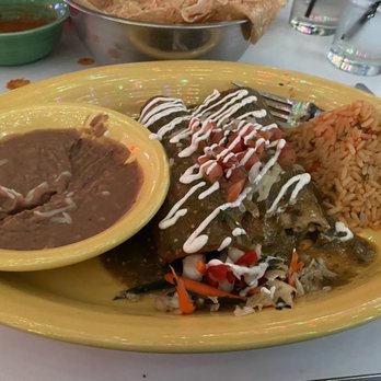 Uno Mas - Mezcal Braised Short Rib Enchiladas w/ beans & rice. Topped with their Verde Salsa. - Tex-Mex Near Me - Dallas, Texas