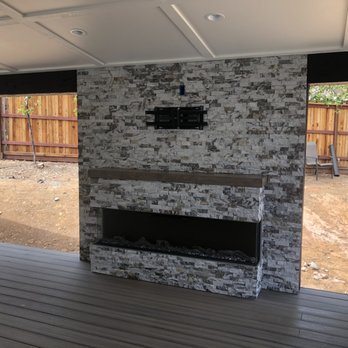 Nystrom Remodel - a fireplace in a backyard - General Contractors Near Me Nystrom Remodel - a fireplace in a backyard - General Contractors Near Me