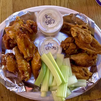 The Pub On 61 - a plate of wings, celery, and dips - Pubs Near Me - Charleston, South Carolina The Pub On 61 - a plate of wings, celery, and dips - Pubs Near Me - Charleston, South Carolina