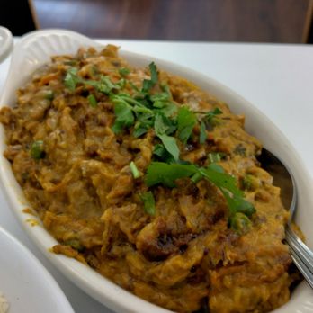 The Indian Night - Bay Goon Bhortha ( roasted eggplant mix w/peas, cilantro, curry sauce) Requested Mild on the curry spice. Delish - Halal Near Me - San Antonio, Texas