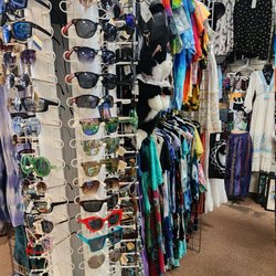 Waterbeds 'n' Stuff - Sunglasses display rack next to cool printed shirts