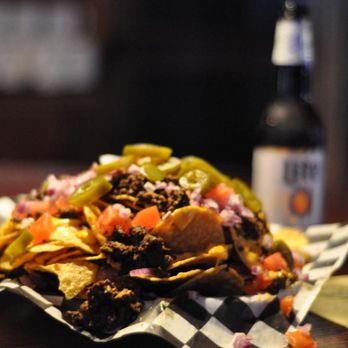Eagleboltbar - a plate of nachos and a bottle of beer - Gay Bars Near Me - Minneapolis, Minnesota Eagleboltbar - a plate of nachos and a bottle of beer - Gay Bars Near Me - Minneapolis, Minnesota