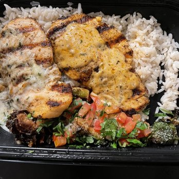 California Fish Grill - Grilled salmon with rice and Brussels sprouts , s garlic butter and Cajun sauce - Seafood Near Me - Pasadena, California California Fish Grill - Grilled salmon with rice and Brussels sprouts , s garlic butter and Cajun sauce - Seafood Near Me - Pasadena, California