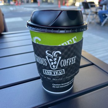 Serious Coffee - a cup of coffee on a table - Coffee & Tea Near Me - New Westminster, British Columbia Serious Coffee - a cup of coffee on a table - Coffee & Tea Near Me - New Westminster, British Columbia
