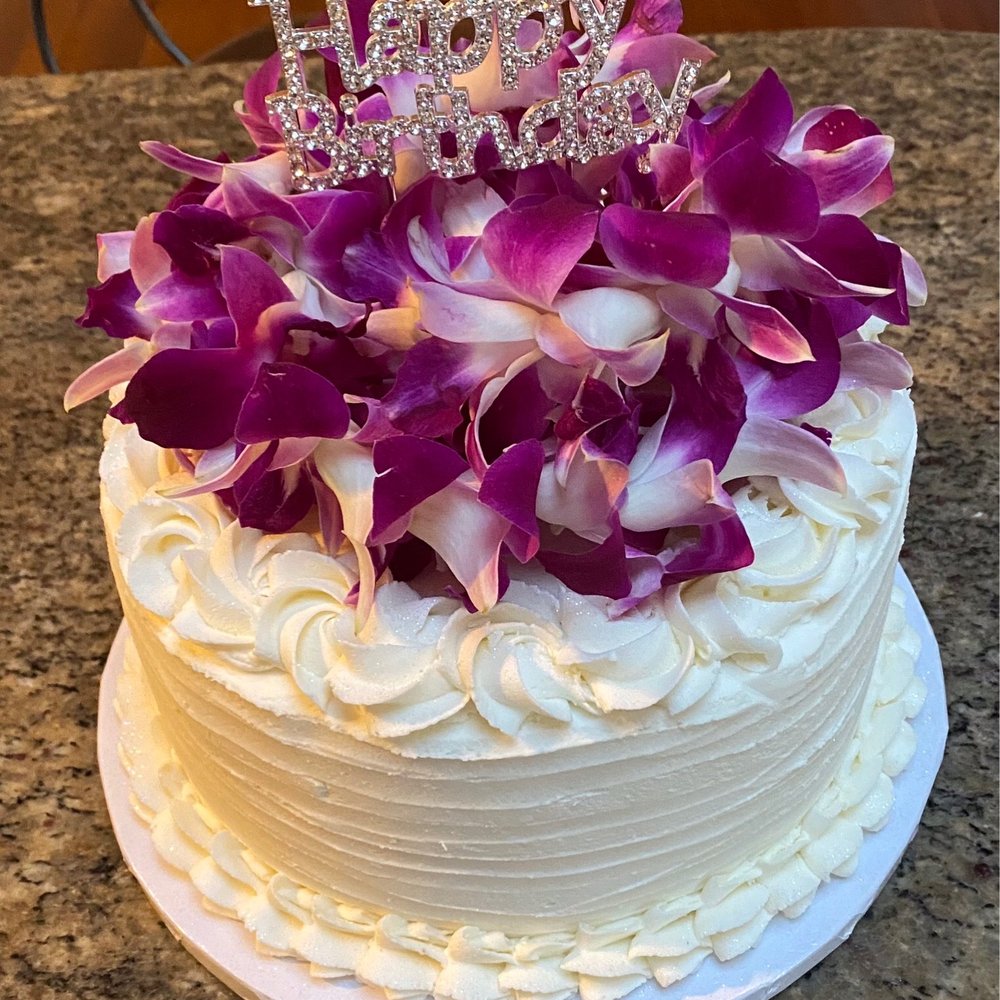 The Sugar Gallery - Carol suggested and orchid lei for the decorations and we added some bling with a Happy Birthday topper. - Custom Cakes Near Me The Sugar Gallery - Carol suggested and orchid lei for the decorations and we added some bling with a Happy Birthday topper. - Custom Cakes Near Me
