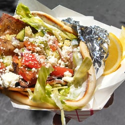 Grilldabeast - Grilldabeast Gyro- seasoned, grilled lamb gyro meat, lettuce, feta, tzatziki, and Mediterranean salsa, on warm pita