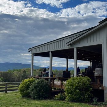 Knight's Gambit Vineyards - Outdoors has plenty sitting spaces or grass for a picnic - Wineries Near Me - Charlottesville, Virginia Knight's Gambit Vineyards - Outdoors has plenty sitting spaces or grass for a picnic - Wineries Near Me - Charlottesville, Virginia