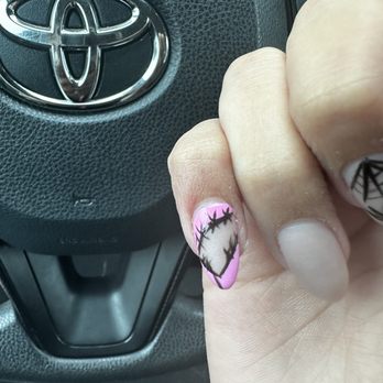 Top Nail - This was the design they made for me and the lines were neither the right color nor were they thin. - Nail Salons Near Me - Joliet, Illinois