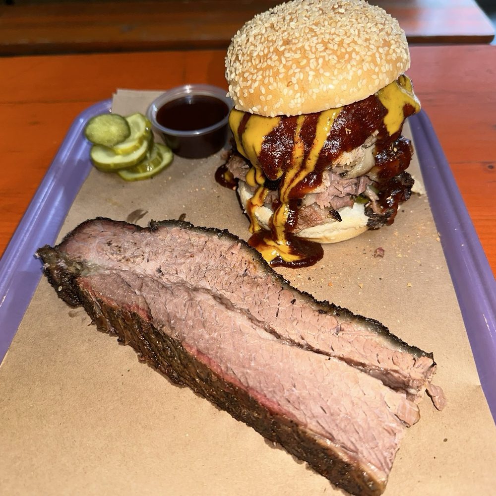 Beef heart of the rodeo sandwich and a slice of brisket. Beef heart of the rodeo sandwich and a slice of brisket.