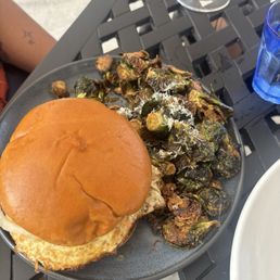 Smash burger (with over easy egg) and Brussel sprouts Smash burger (with over easy egg) and Brussel sprouts