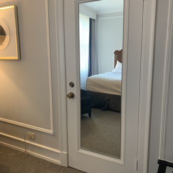 The Peabody Memphis - The mirror on the connecting door between rooms provides a view to one of the comfortable beds, the pillows were fabulous! - Hotels Near Me - Memphis, Tennessee The Peabody Memphis - The mirror on the connecting door between rooms provides a view to one of the comfortable beds, the pillows were fabulous! - Hotels Near Me - Memphis, Tennessee