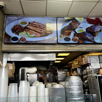 Punta Cana - a large television above a restaurant counter - Dominican Near Me - Fort Lee, New Jersey Punta Cana - a large television above a restaurant counter - Dominican Near Me - Fort Lee, New Jersey