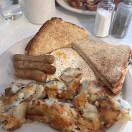Eggs, sausage, hash browns and toast Eggs, sausage, hash browns and toast