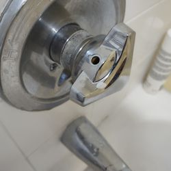 Regency Inn and Suites - Bathroom faucet is loose.
