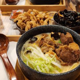 Beef brisket noodle soup with deep fried pork and wood ear mushroom