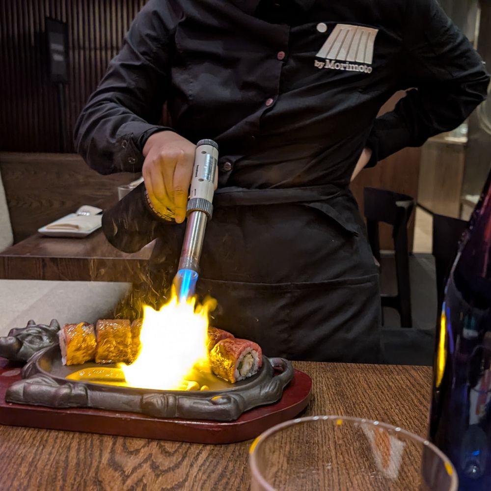 MM by Morimoto - Torching the Surf & Turf Roll at the table - Japanese Near Me - Montclair, New Jersey MM by Morimoto - Torching the Surf & Turf Roll at the table - Japanese Near Me - Montclair, New Jersey