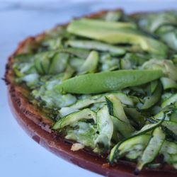 Our NEW Green Goddess Pizza is made with. a cauliflower crust, vegan pesto, roasted zucchini, topped with avocado & basil.