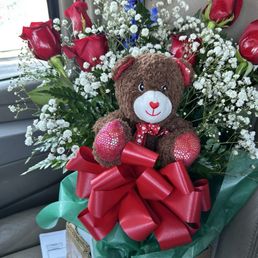 Flowers with a cute bear Flowers with a cute bear