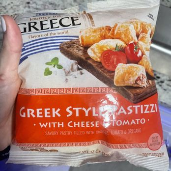 ALDI - a hand holding a packet of greek style pasta - Grocery Near Me - Port Saint Lucie, Florida