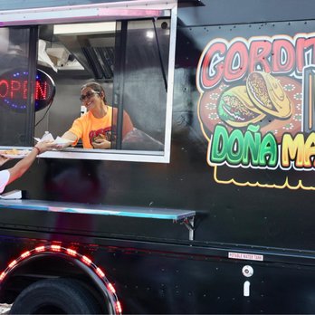 Gorditas Doña Mago - a man serving food from a food truck - Tacos Near Me - Houston, Texas
