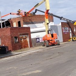 Jaren Industries - Taking off roof by hand.