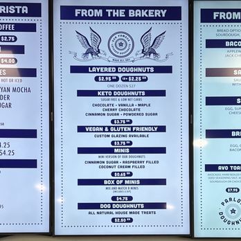 Parlor Doughnuts - Menu. - Three menu boards list various food and beverage options, including coffee, doughnuts, breakfast items, and more, at Parlor Doughnuts. - Coffee & Tea Near Me - Fruit Cove, Florida