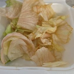 Tako Yaki - The caption box asks "What's in this photo?" No clue. Was hoping it was the lettuce i ordered.