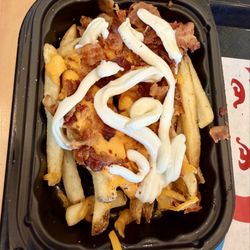 Baconator Fries with Sour Cream squeezed over it