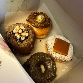 Friendly Donuts - Top L to R: S'mores, Nutella/Ferrero Rocher Bottom L to R: Glazed Ube Donut, Flan doughnut - Donuts Near Me - Orange, California Friendly Donuts - Top L to R: S'mores, Nutella/Ferrero Rocher Bottom L to R: Glazed Ube Donut, Flan doughnut - Donuts Near Me - Orange, California