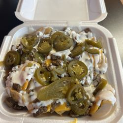 El Taco Loco - Steak nachos with jalapeños, sour cream & melted cheese (ask for no pico)