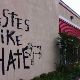 the words tastes like hate written on the side of a building the words tastes like hate written on the side of a building