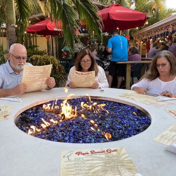 Pop's Sunset Grill - The fire tables are amazing to sit at and enjoy great food! - Seafood Near Me - Nokomis, Florida