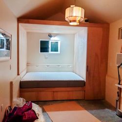 Mat-Su Carpentry and Construction - Totally custom bed with storage underneath, closet, and loft above. This was a remodeled garage