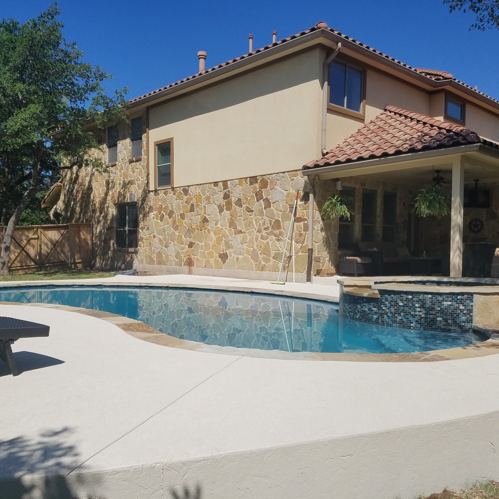 Chaparrel Pools - a house with a pool in the backyard - Hot Tub & Pool Near Me - Austin, Texas