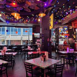 Champy's Chicken - Dining area with open windows to the street