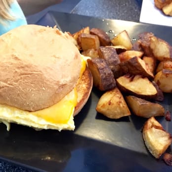 The Blue Hen Cafe - Breakfast sandwich with a side of home fries which are an extra charge - Southern Near Me - Saint Augustine, Florida