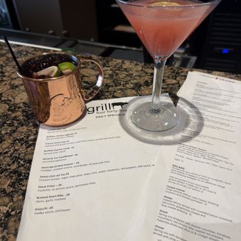 Grill Four Forty-Five - Bar area with a blueberry mule and a raspberry cosmo and menus - New American Near Me - Brooklyn, Connecticut