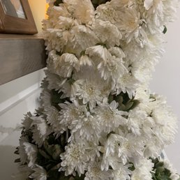 What a messy work!!!!! And cheap flowers. She charged $400 for this mess.