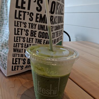Freshii - a green smoothie in a plastic cup - Salad Near Me - Brandon, Manitoba