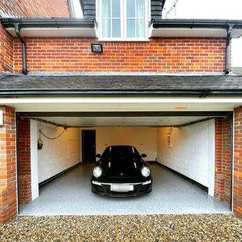 SM Custom Coatings - a car in a garage - Flooring Near Me SM Custom Coatings - a car in a garage - Flooring Near Me