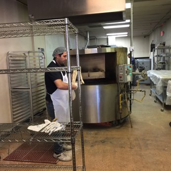 Noosh Bakery - Stretching the dough before putting it on the grill behind. - Persian/Iranian Near Me - Las Vegas, Nevada Noosh Bakery - Stretching the dough before putting it on the grill behind. - Persian/Iranian Near Me - Las Vegas, Nevada