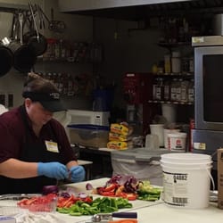 Lannings Foods - Prepping food. The kitchens are in the open.  Look at all the fresh veggies!